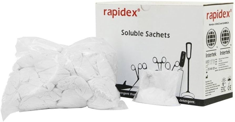 A bag of white Rapidex soluble detergent sachets next to its white packaging box on a plain white background.