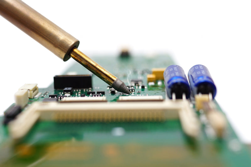 Soldering iron and a circuit board