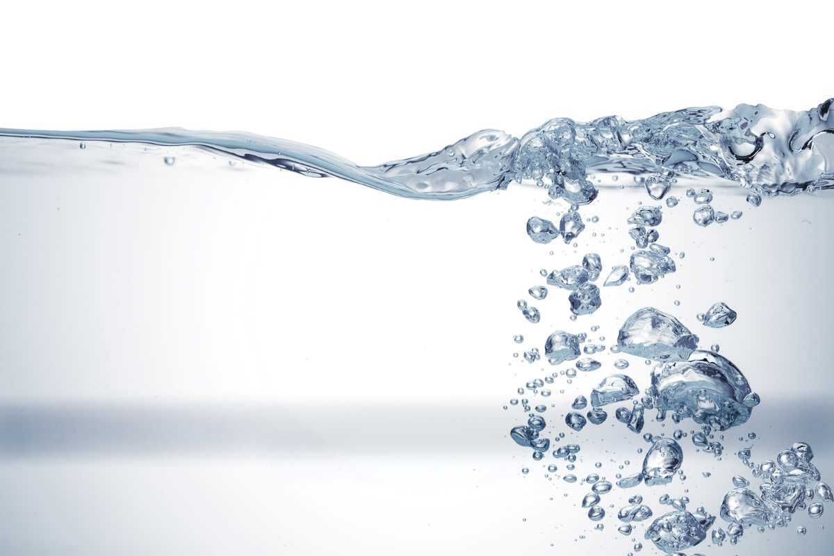 Clear water with bubbles on a white background