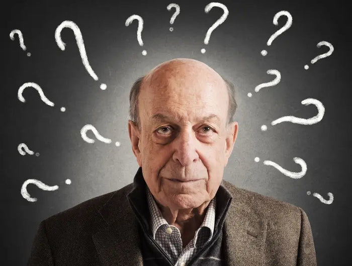 man with question marks around his head